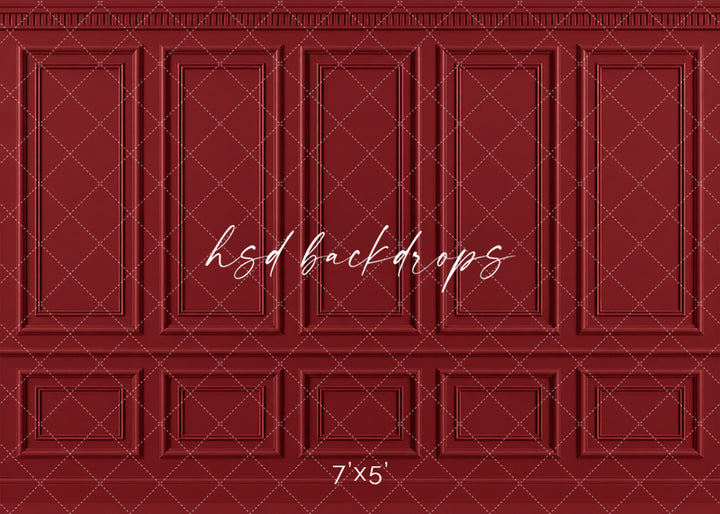 Vintage Red French Panel photography backdrop featuring traditional French-inspired boiserie wall molding, five tall symmetrical rectangular panels, ornate dentil-style crown molding, a classic chair rail, and coordinating lower wainscoting in a rich vintage Christmas red finish for holiday, fine art, maternity, and elegant studio portraits.