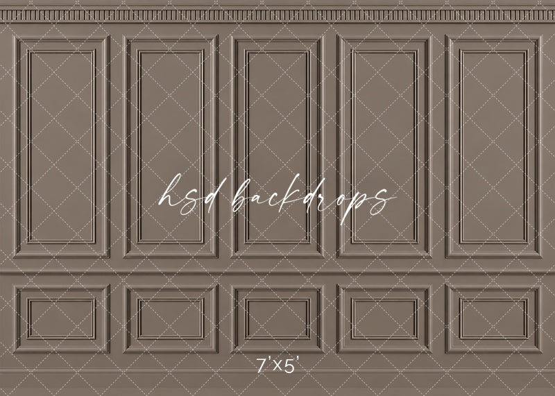 Warm Taupe French Panel photography backdrop featuring traditional French-inspired boiserie wall molding, five tall symmetrical rectangular panels, ornate dentil-style crown molding, a classic chair rail, and coordinating lower wainscoting in a sophisticated warm taupe, mushroom brown, and soft greige finish for fine art, maternity, newborn, branding, and elegant studio portraits.