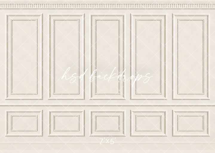 Classic Cream French Panel photography backdrop featuring traditional French-inspired boiserie wall molding, five tall symmetrical rectangular panels, ornate dentil-style crown molding, a classic chair rail, and coordinating lower wainscoting in a soft champagne ivory, warm cream, and antique white finish for fine art, maternity, newborn, bridal, and elegant studio portraits.