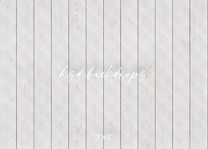 Whitewashed Wood Plank photography backdrop with bright white vertical wood boards, subtle wood grain texture, soft neutral tones, and clean studio portrait wall styling.
