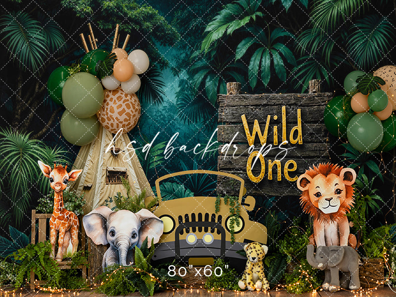 Safari Wild One birthday photography backdrop with jungle greenery, safari animals, vintage jeep, balloon clusters, and wild one sign for boys birthday portraits.