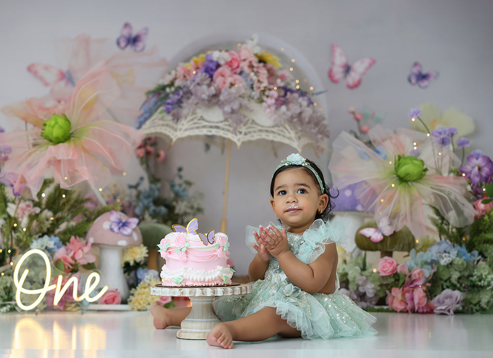 Enchanted Butterfly Parasol photography backdrop with a floral parasol, pastel butterflies, tulle flowers, mushrooms, and soft garden florals for girls birthday portrait photography.