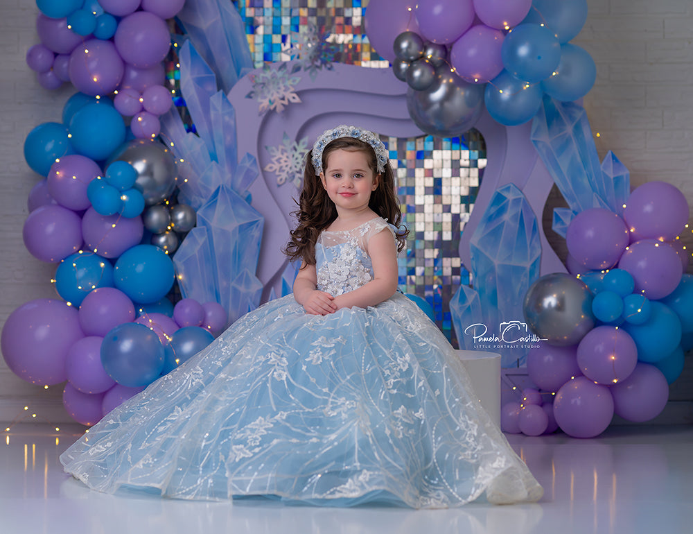 Crystal Glam Birthday photography backdrop with a lavender arch, silver sequin wall, icy crystal accents, snowflakes, and lavender blue balloon clusters for girls portrait photography.