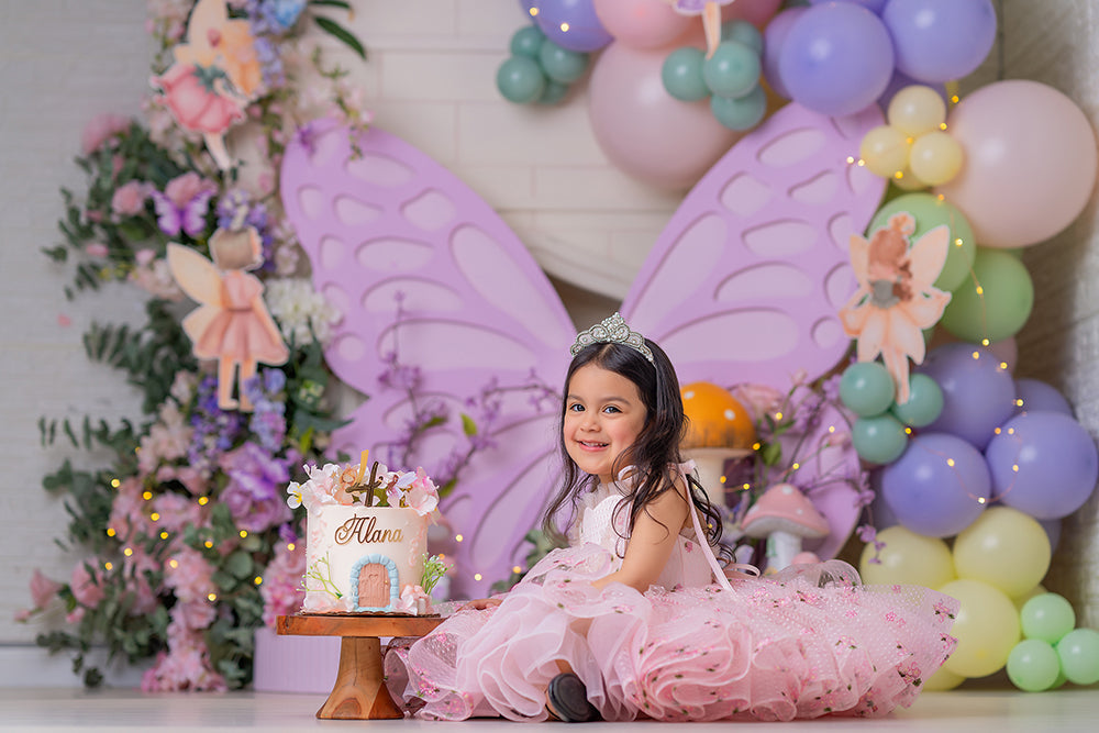 Lavender Fairy Butterfly photography backdrop with oversized lavender butterfly wings, pastel balloons, fairy illustrations, flowers, mushrooms, and whimsical garden styling for portrait photography.