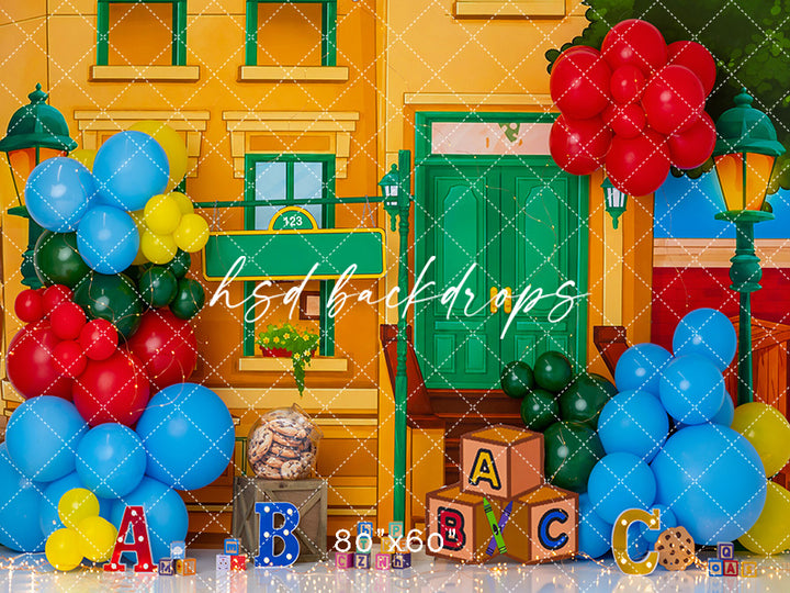 ABC Block Birthday photography backdrop with colorful balloon clusters, alphabet blocks, primary color accents, and playful birthday styling for children’s portrait photography.