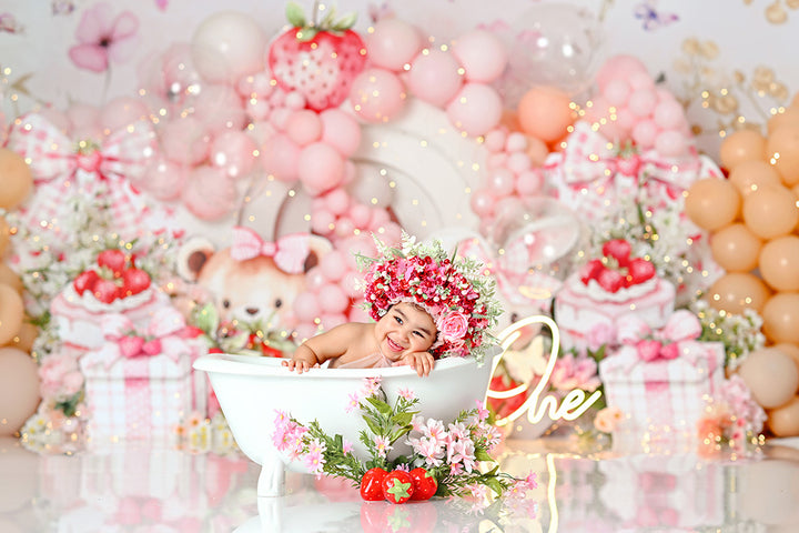 Sweet Berry One-derland cake smash backdrop with strawberries, bunny, bear, balloons, and pink butterfly accents