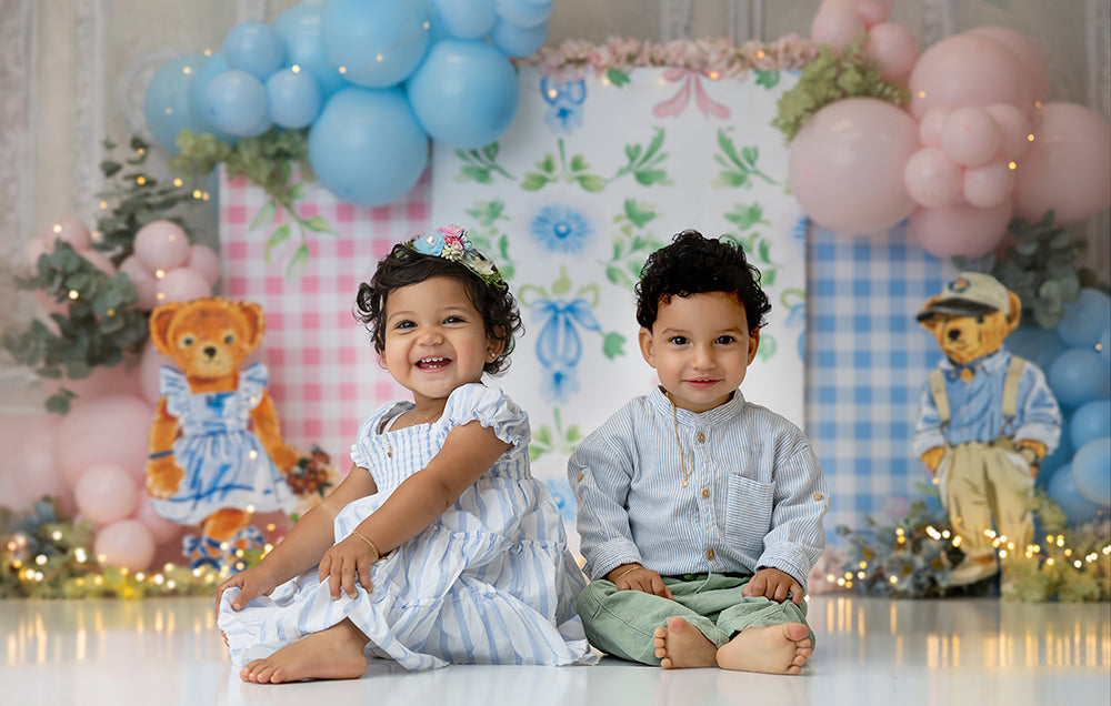Pastel photo backdrop with pink and blue gingham, floral panels, and balloon garlands – Chic Country Club design by HSD Backdrops.