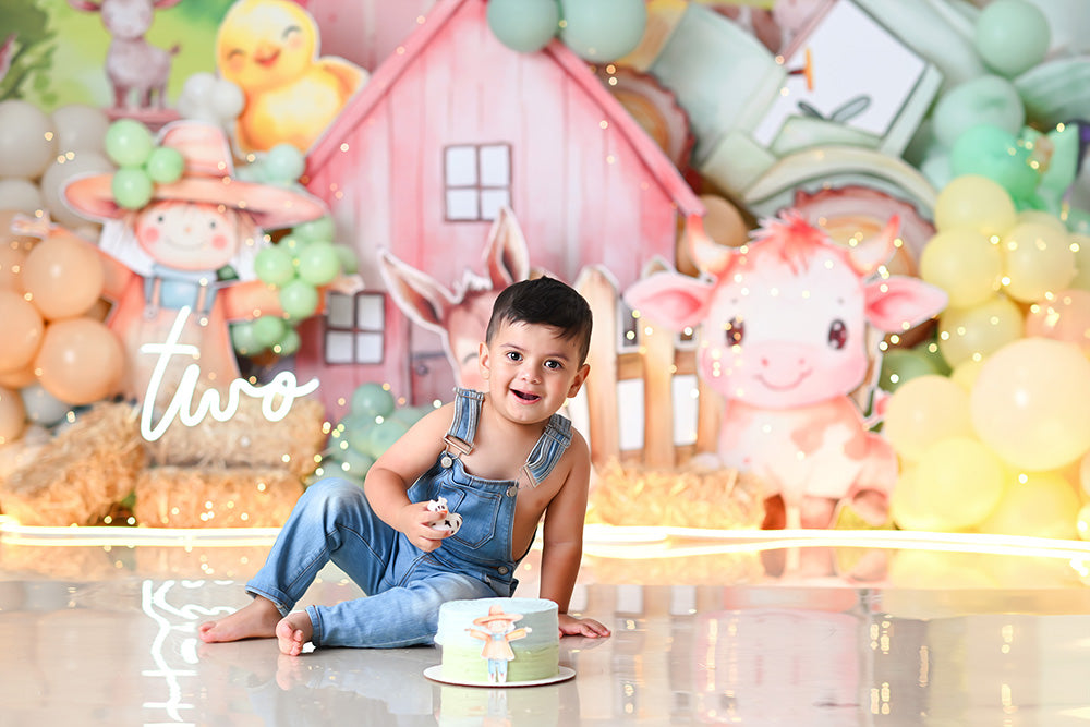 Pastel farm animal birthday backdrop with pink barn, cow, donkey, and balloons – HSD Backdrops
