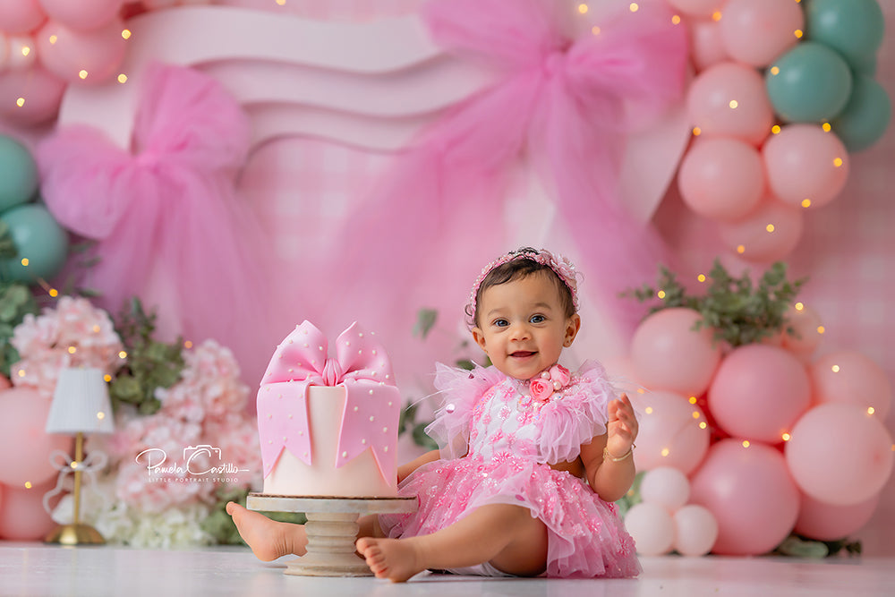 Pink Tulle Garden Party backdrop with gingham, pink tulle, balloons, and flowers