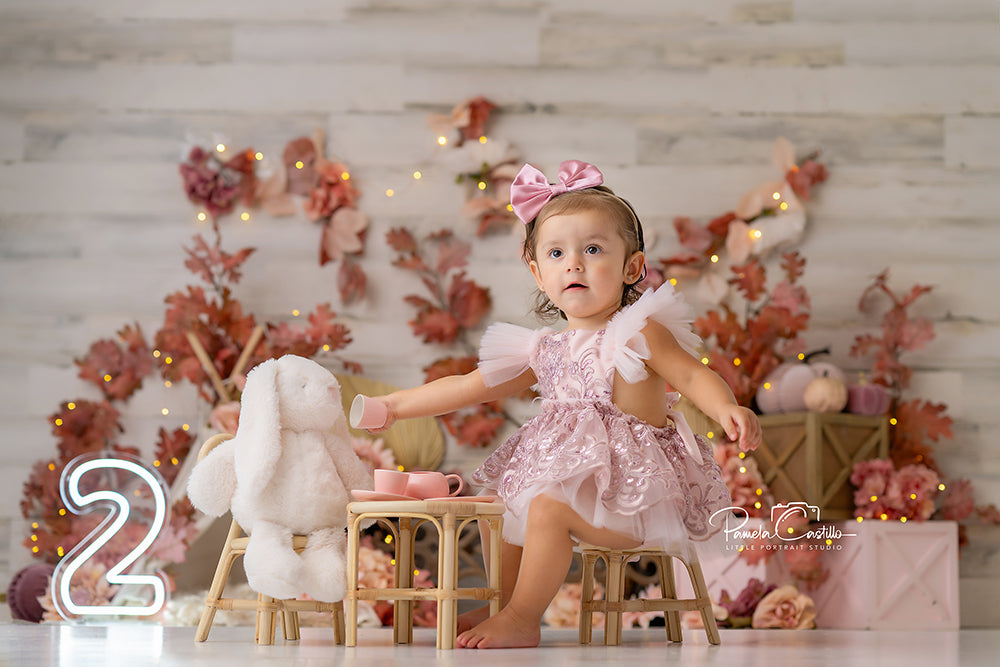 Blush Harvest Birthday backdrop with pumpkins, blush florals, and “ONE” sign