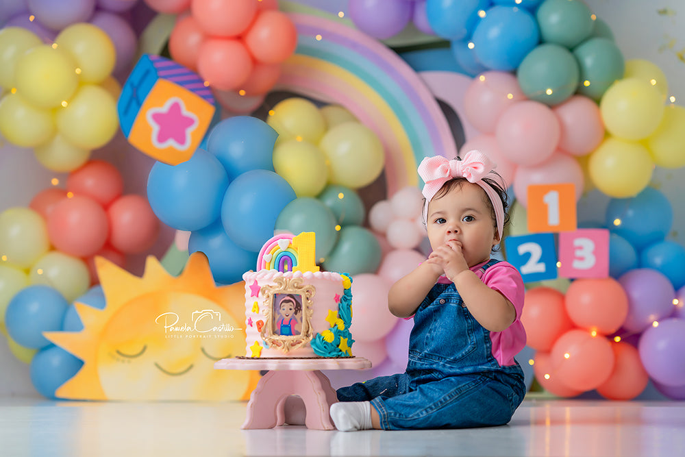 Rainbow Learning Dreams backdrop with pastel balloons, rainbow, sun, and number blocks