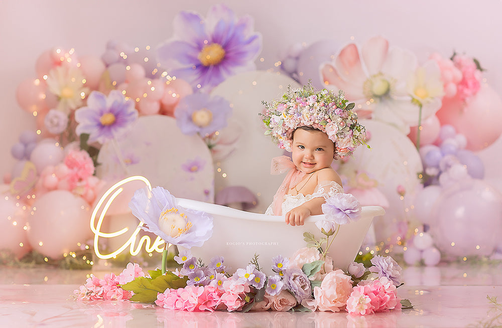 Whimsical Fairy Garden backdrop with pastel mushrooms, balloons, and purple flowers