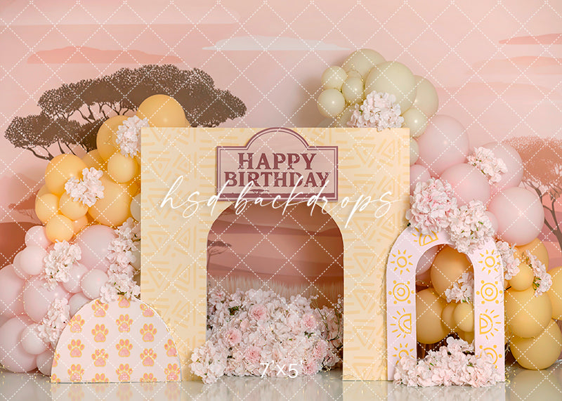 Safari Celebration Wild One cake smash backdrop with neutral balloons, acacia trees, and tribal birthday arch design for jungle-themed photoshoots.