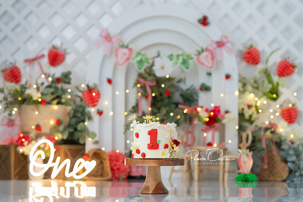 Sweet Strawberry Patch cake smash backdrop with strawberries, gingham bows, and floral greenery for summer photoshoots.