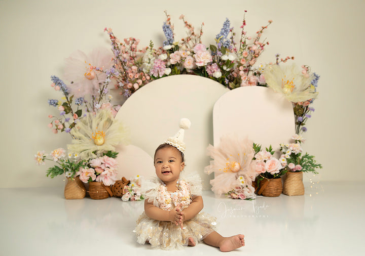 Whispering Blooms spring floral arch photography backdrop with pastel flowers and neutral tones.