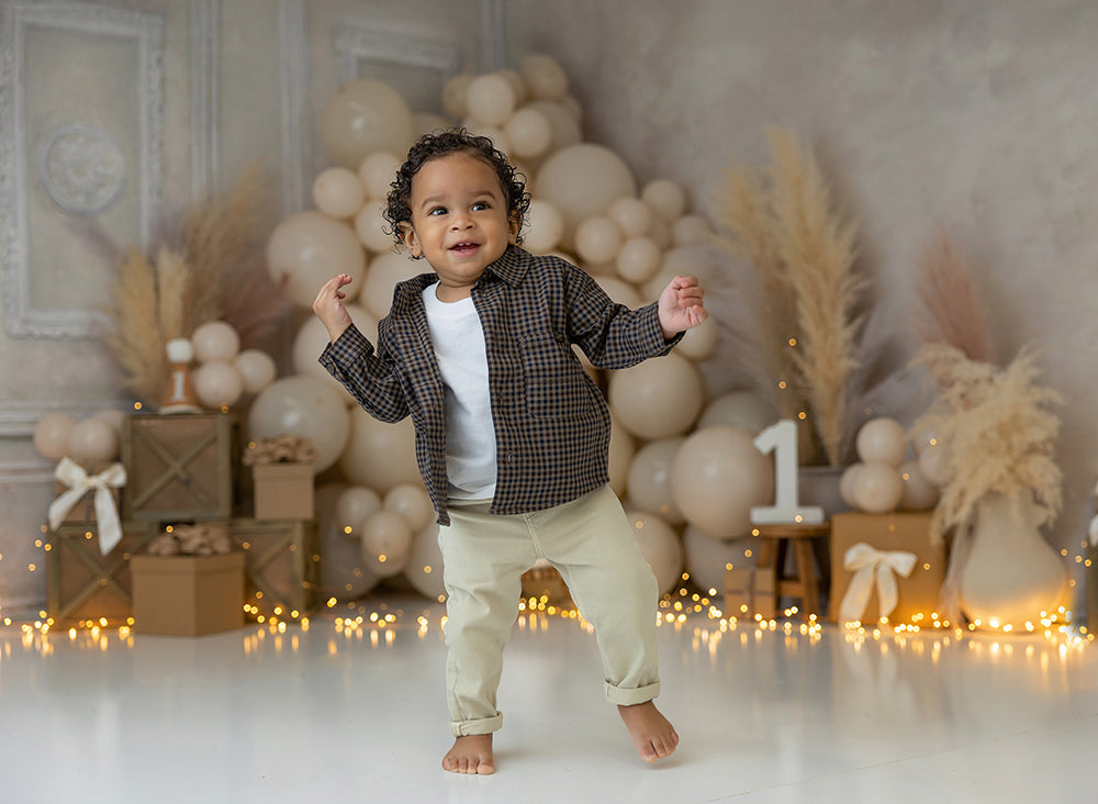 Boho Dreamer neutral balloon and pampas grass photography backdrop with wooden crates and soft beige tones.