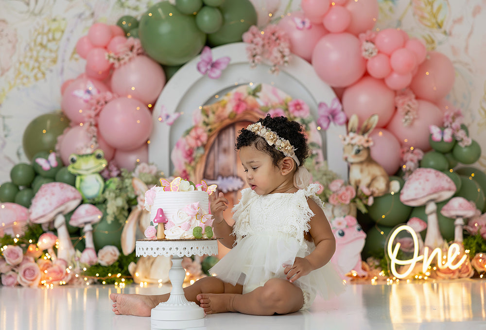 Enchanted Fairy Garden Scape photography backdrop with fairy door, woodland animals, and pastel balloons.