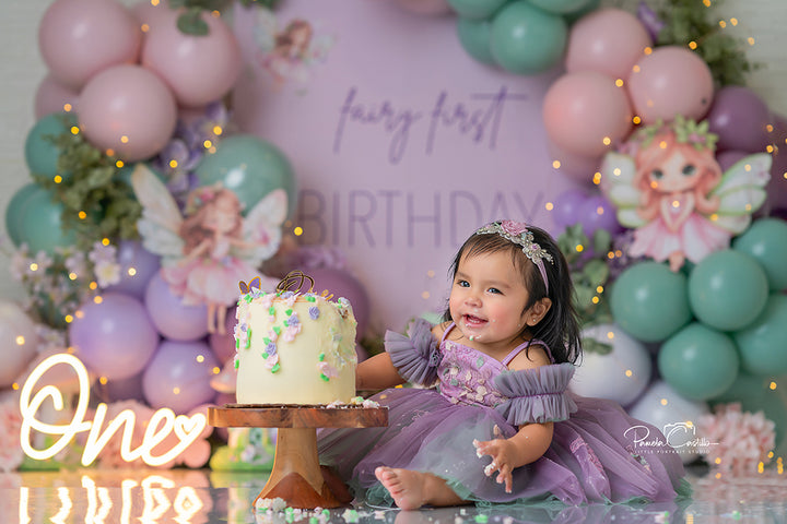 Fairy First Birthday photography backdrop with pastel balloons, pink and mint fairy accents, butterflies, and mushrooms for whimsical birthday and cake smash portraits.