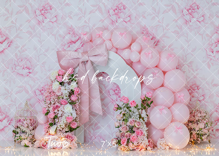 Blush Bloom Bow Two photography backdrop with pink florals, balloons, and bow for second birthday cake smash and milestone photo sessions.