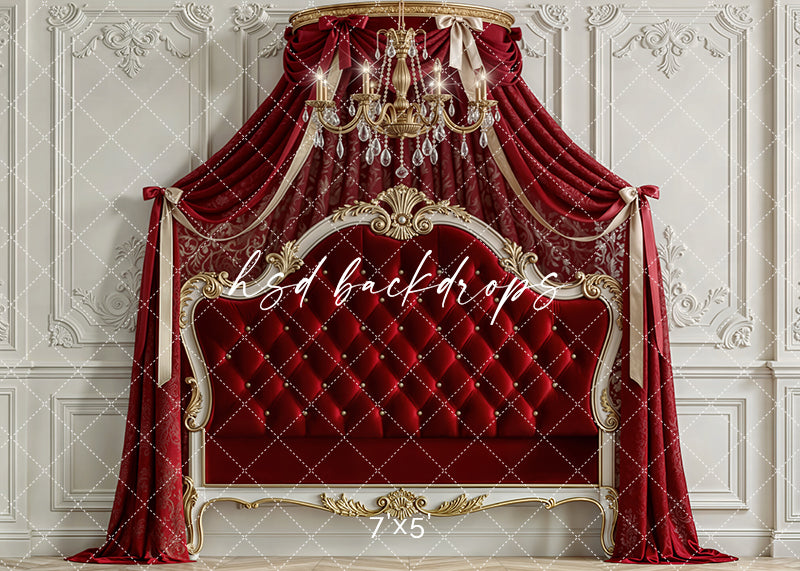 Scarlet red princess room scene with velvet canopy drapes, gold chandelier, and tufted royal headboard for children’s photography.