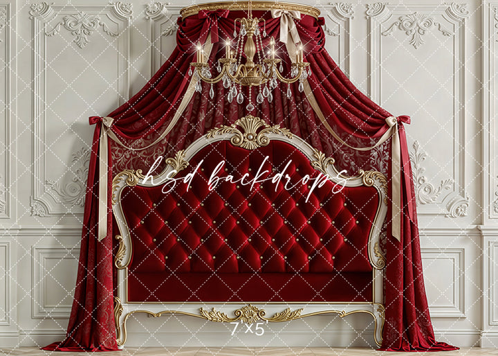 Scarlet red princess room scene with velvet canopy drapes, gold chandelier, and tufted royal headboard for children’s photography.