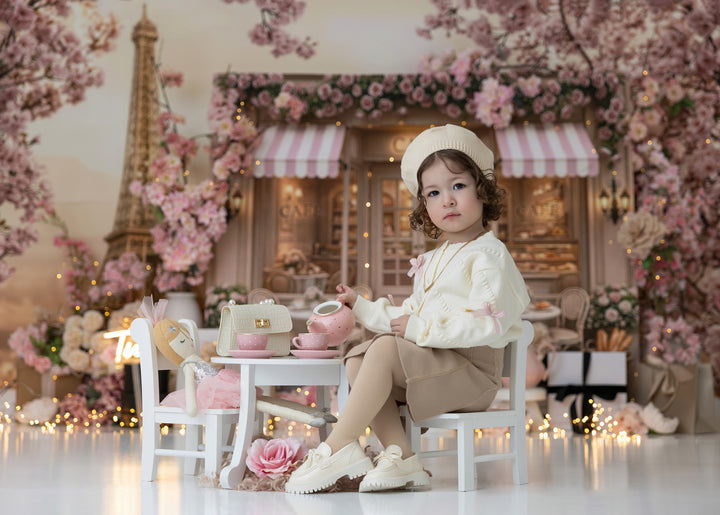 Paris tea party birthday photography backdrop with pink floral café storefront and cherry blossoms, girl cake smash portrait background.